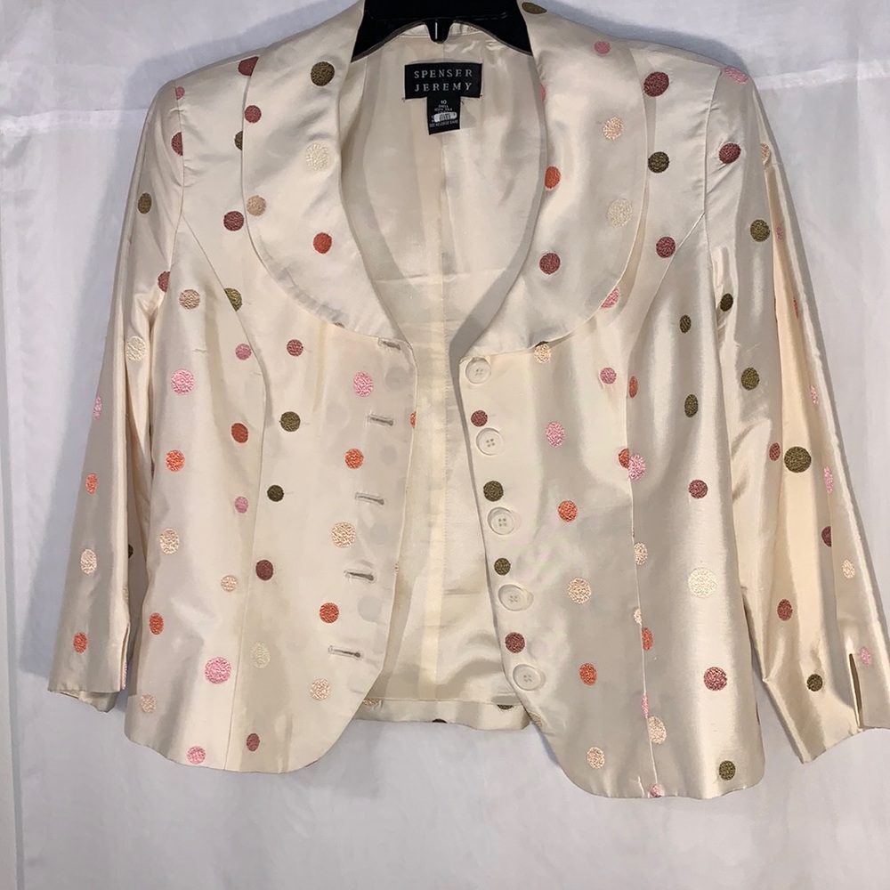 A Spenser Jeremy skirt suit size 10. Multi colored dots with cream background.